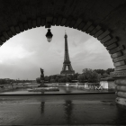 Black and white composition of eiffel tower with bridge forming frame Paris France